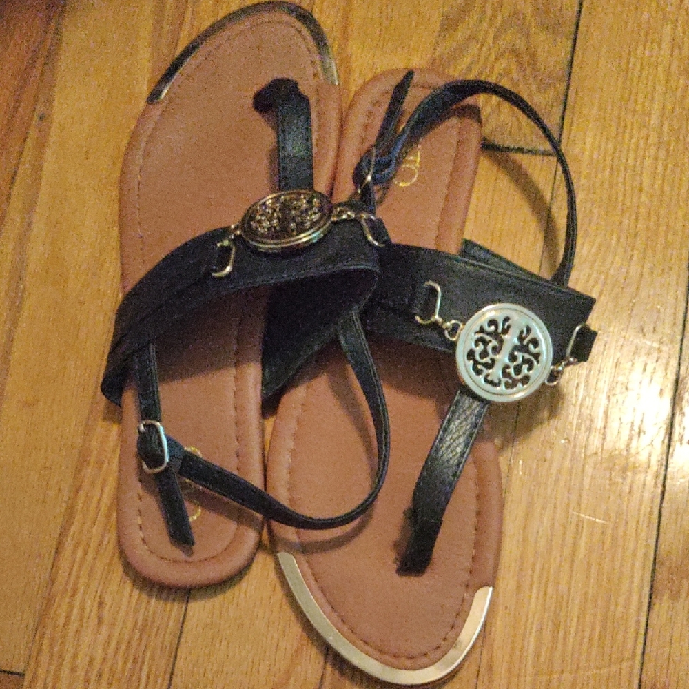 Sleek Black Leather Sandals with Medallion